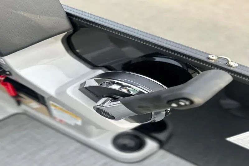 Slide: The Image of Close-up of 2026 Lowe LS 210 WT boat throttle control handle. - 35