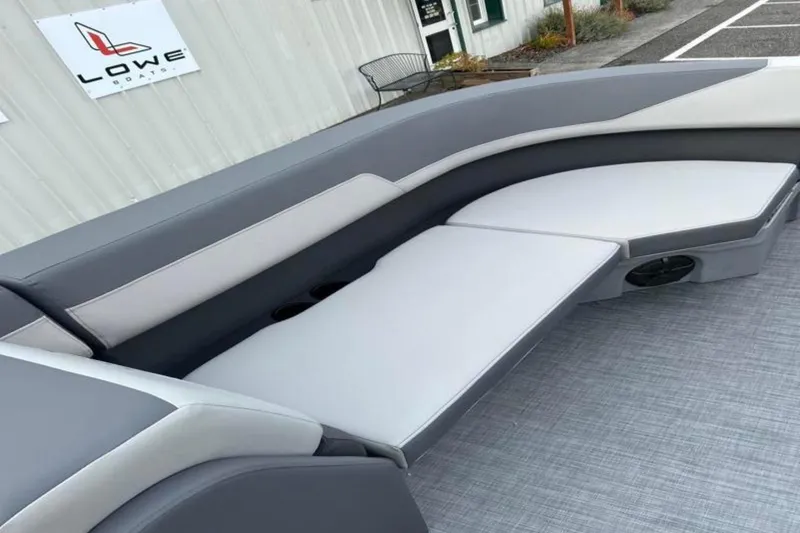 Slide: The Image of Modern Lowe LS 210 WT boat interior with sleek gray seating, 2026 model. - 38