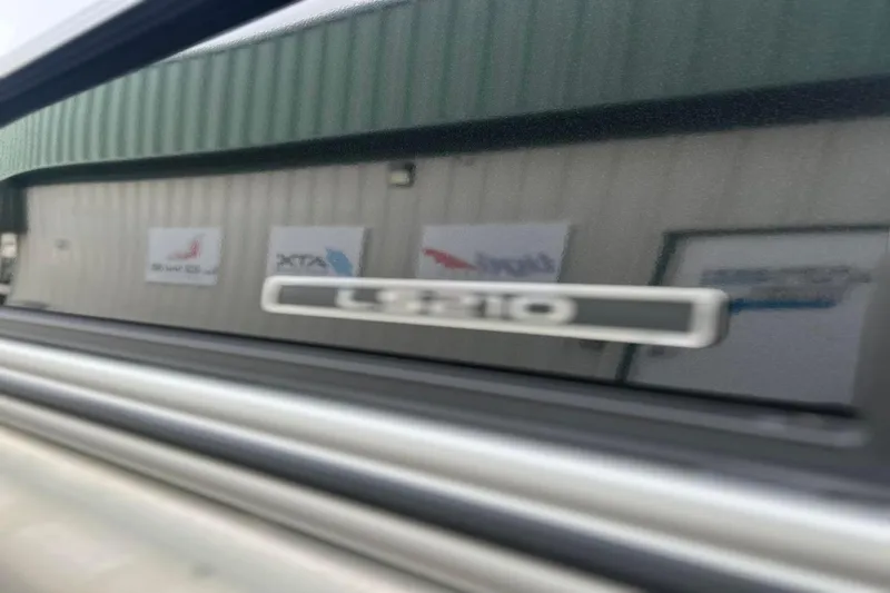 Slide: The Image of Reflection of a Lowe LS 210 WT 2026 boat on a building window. - 8