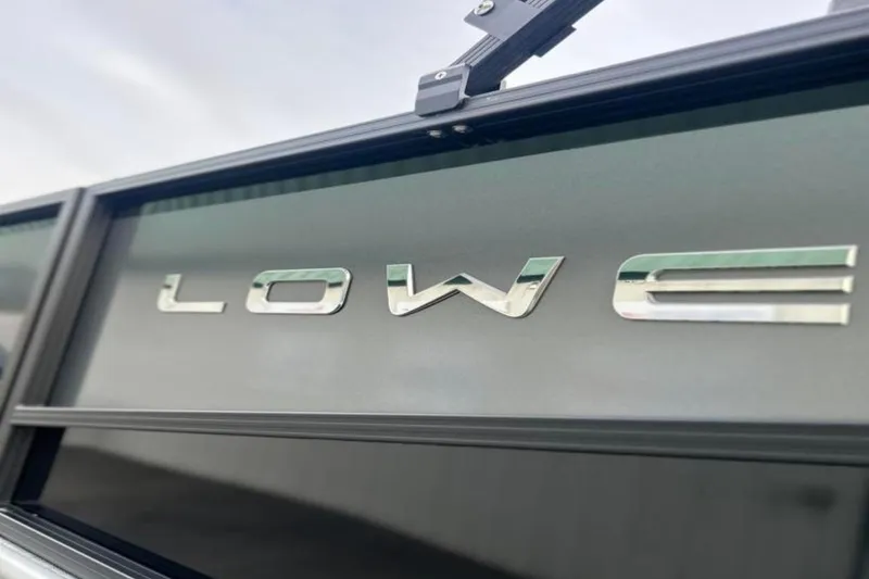 Slide: The Image of Close-up of 2026 Lowe LS 210 WT boat logo on sleek surface. - 9
