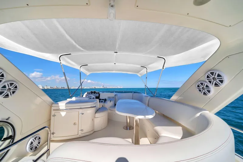 Slide: The Image of Luxurious 2006 Azimut 50 Fly yacht interior with ocean view and elegant seating. - 5