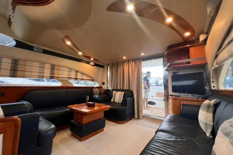 Slide: The Image of Luxurious interior of a 2006 Azimut 50 Fly yacht with elegant seating and modern amenities. - 8