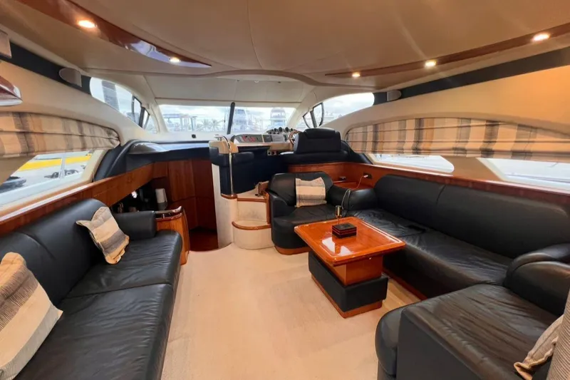 Slide: The Image of Luxurious interior of 2006 Azimut 50 Fly yacht with leather seating and wooden accents. - 9