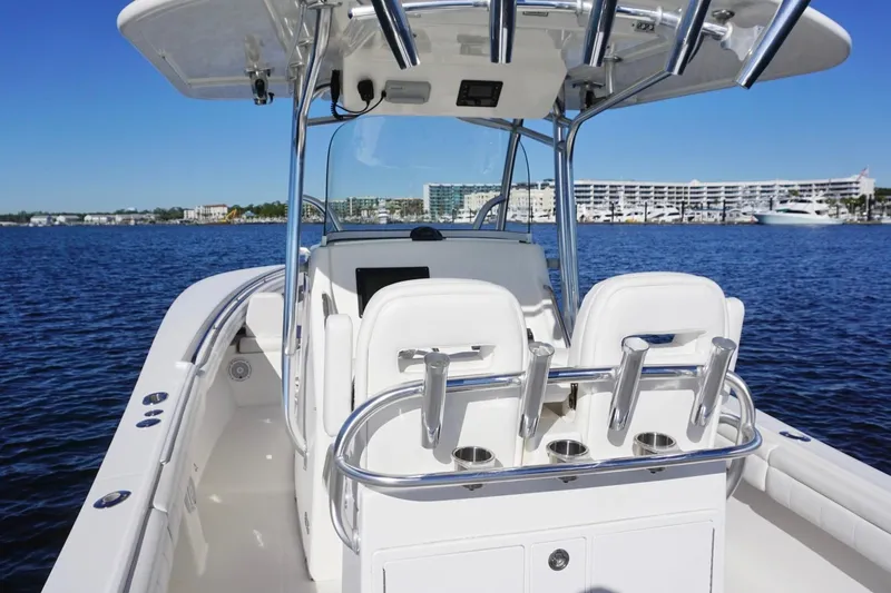 Slide: The Image of 2018 Regulator 28 boat on water, featuring sleek design and modern amenities. - 20