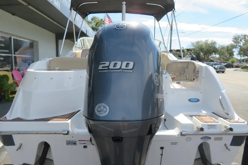 Slide: The Image of 2015 Sea Fox 226 Traveler boat with Yamaha 200 engine, parked outdoors. - 10