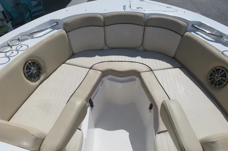 Slide: The Image of 2015 Sea Fox 226 Traveler boat interior with beige seating and cup holders. - 11