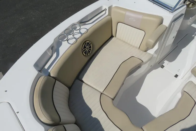Slide: The Image of 2015 Sea Fox 226 Traveler boat interior with beige seating and cup holders. - 12