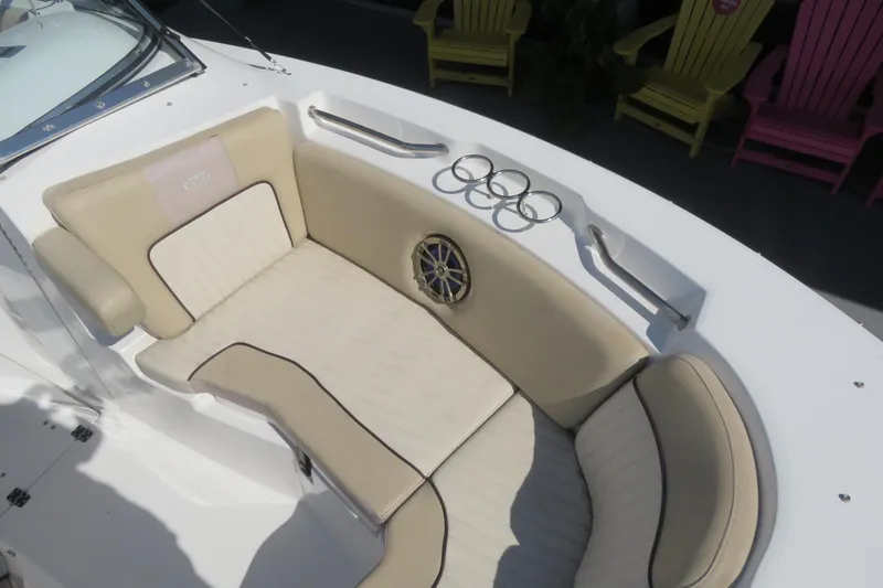 Slide: The Image of 2015 Sea Fox 226 Traveler boat interior with beige seating and cup holders. - 13