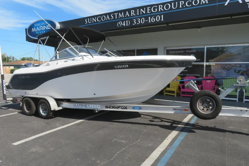 Slide: The Image of 2015 Sea Fox 226 Traveler boat on trailer at Suncoast Marine Group dealership. - 2