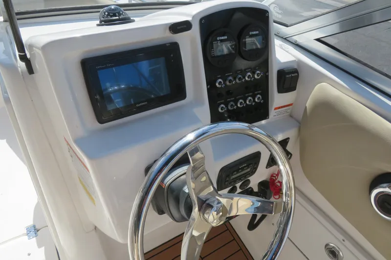 Slide: The Image of 2015 Sea Fox 226 Traveler boat dashboard with steering wheel and navigation controls. - 20