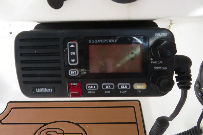 Slide: The Image of Uniden marine radio on 2015 Sea Fox 226 Traveler boat dashboard. - 25