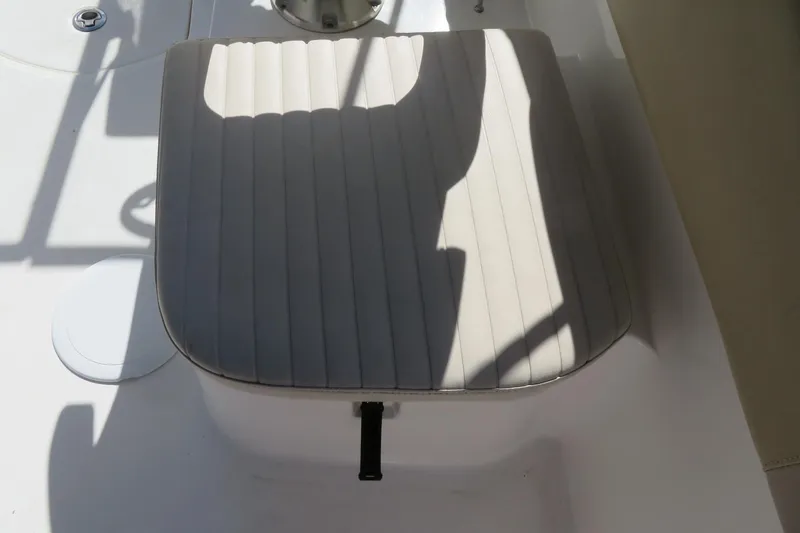 Slide: The Image of 2015 Sea Fox 226 Traveler boat seat with striped upholstery and shadow. - 32