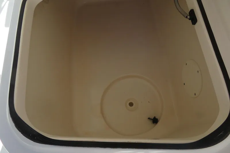 Slide: The Image of 2015 Sea Fox 226 Traveler boat storage compartment, beige interior, open lid view. - 33