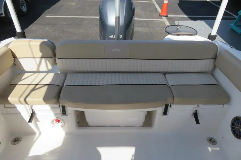 Slide: The Image of 2015 Sea Fox 226 Traveler boat interior seating with beige cushions. - 34
