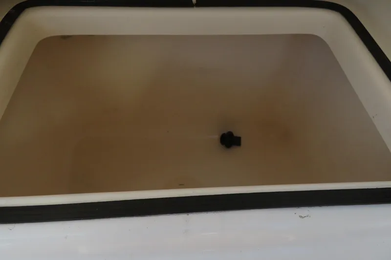 Slide: The Image of 2015 Sea Fox 226 Traveler boat compartment interior with drain plug. - 35