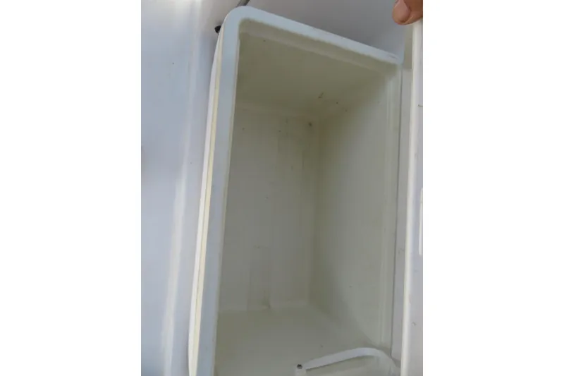 Slide: The Image of Empty storage compartment on a 2015 Sea Fox 226 Traveler boat. - 38