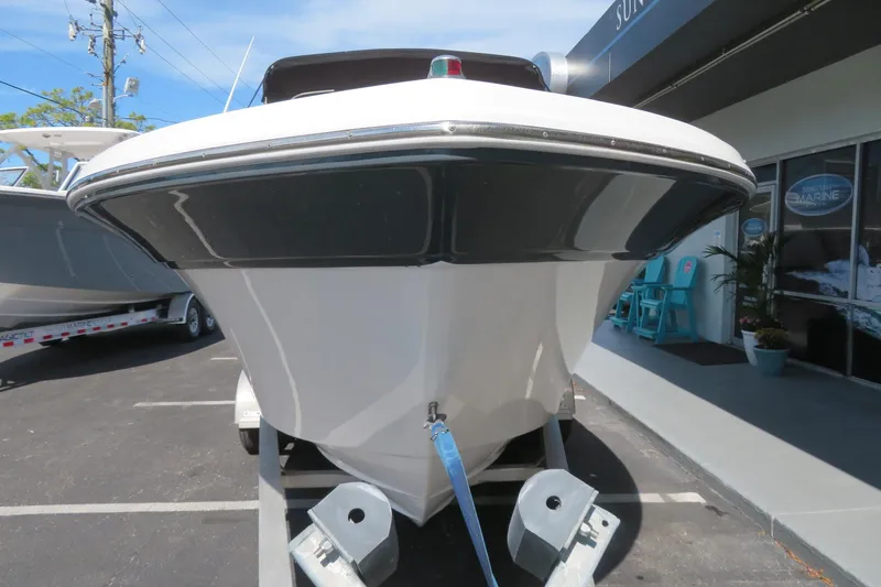 Slide: The Image of 2015 Sea Fox 226 Traveler boat on trailer, parked outside a marine shop. - 4