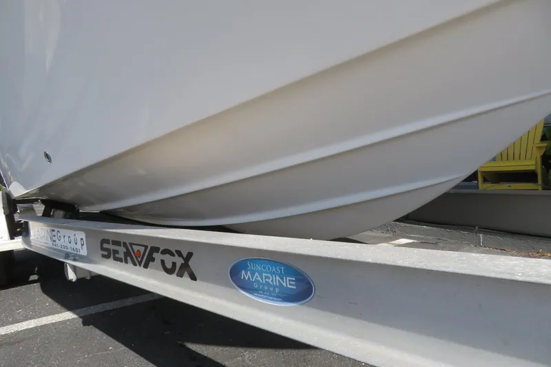 Slide: The Image of 2015 Sea Fox 226 Traveler boat on trailer, Suncoast Marine Group branding visible. - 5