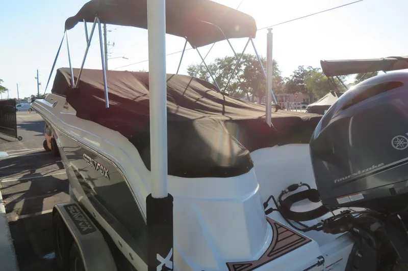 Slide: The Image of 2015 Sea Fox 226 Traveler boat with Yamaha outboard engine, covered and parked outdoors. - 51