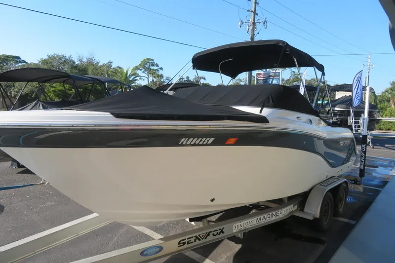 Slide: The Image of 2015 Sea Fox 226 Traveler boat on trailer with black canopy and cover. - 52