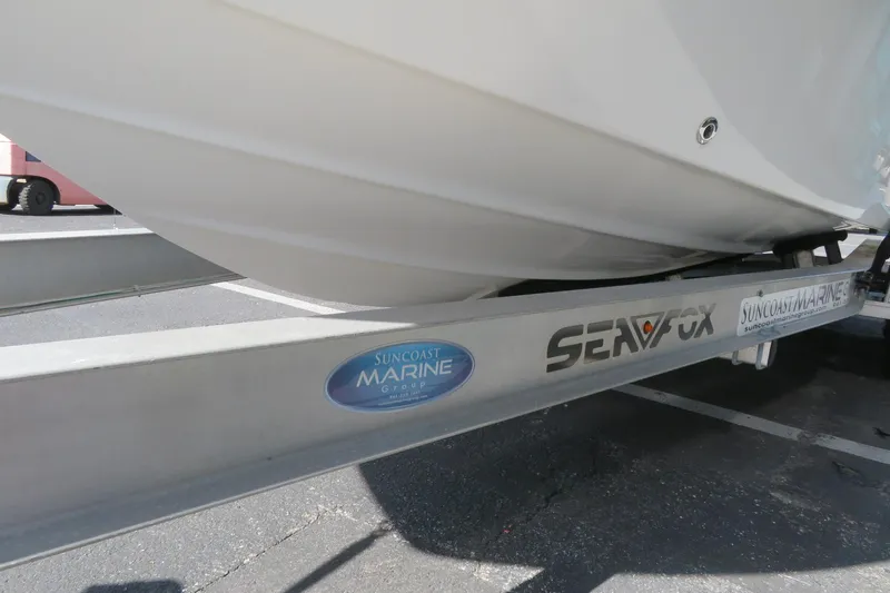 Slide: The Image of 2015 Sea Fox 226 Traveler boat on trailer, Suncoast Marine branding visible. - 6