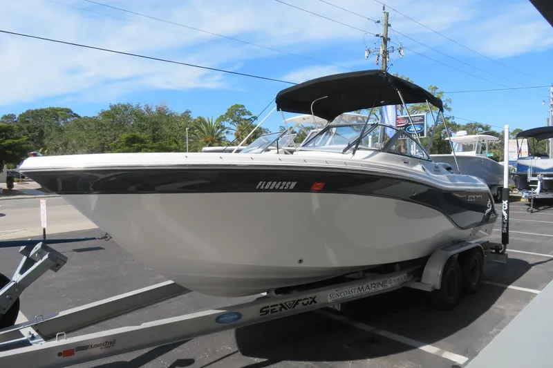 Slide: The Image of 2015 Sea Fox 226 Traveler boat on trailer, parked outdoors under clear sky. - 7