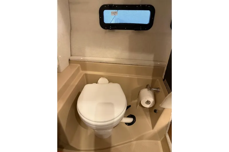 Slide: The Image of 2016 Ranger Tugs R-31 CB boat bathroom with toilet and window. - 23