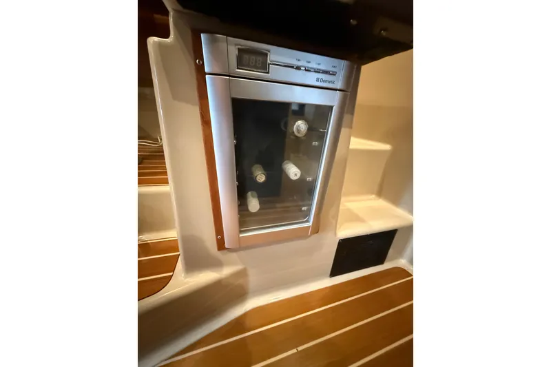 Slide: The Image of 2016 Ranger Tugs R-31 CB interior with built-in Dometic wine cooler. - 38