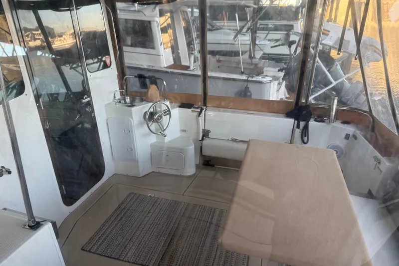 Slide: The Image of 2016 Ranger Tugs R-31 CB helm with steering wheel and sink. - 6