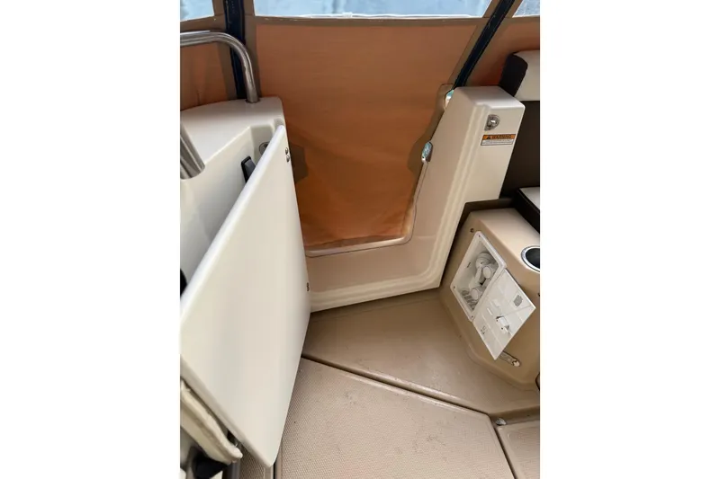 Slide: The Image of Interior view of 2016 Ranger Tugs R-31 CB boat, featuring a compact seating area. - 8