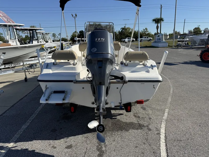 Slide: The Image of 2014 Key West 186br boat with outboard motor in a marina setting. - 7