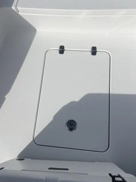 Slide: The Image of 2024 Blazer GTS 2550 BAY boat storage compartment with secure latch and sleek design. - 16