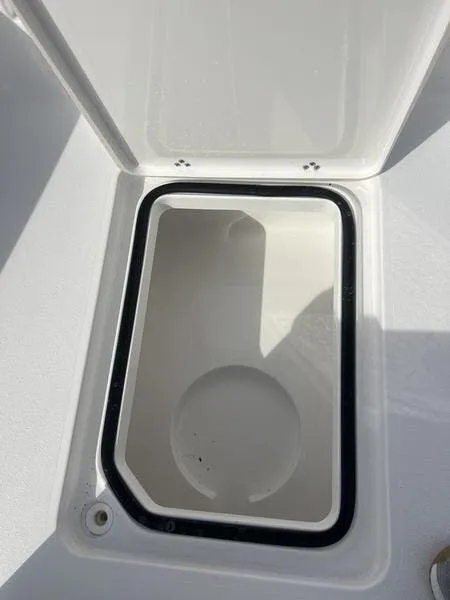 Slide: The Image of Open storage compartment on 2024 Blazer GTS 2550 BAY boat. - 18