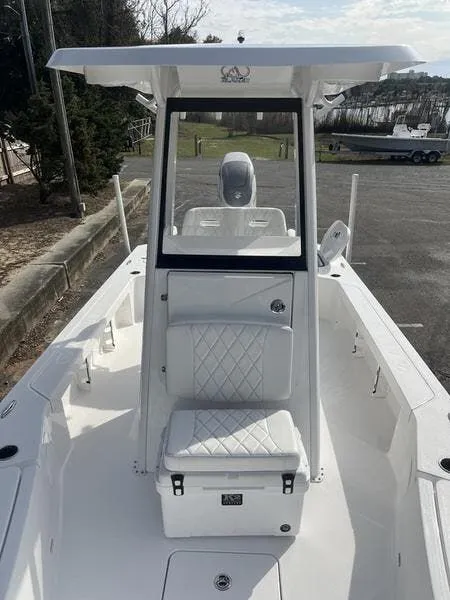 Slide: The Image of 2024 Blazer GTS 2550 BAY boat with sleek white interior and modern design. - 9