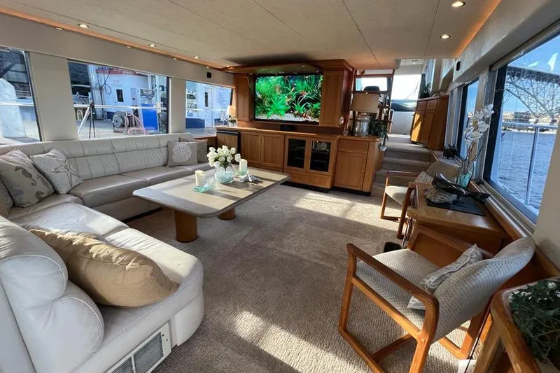 Slide: The Image of Luxurious interior of a 1999 Pacific Mariner 65 Motoryacht with elegant furnishings and large windows. - 27