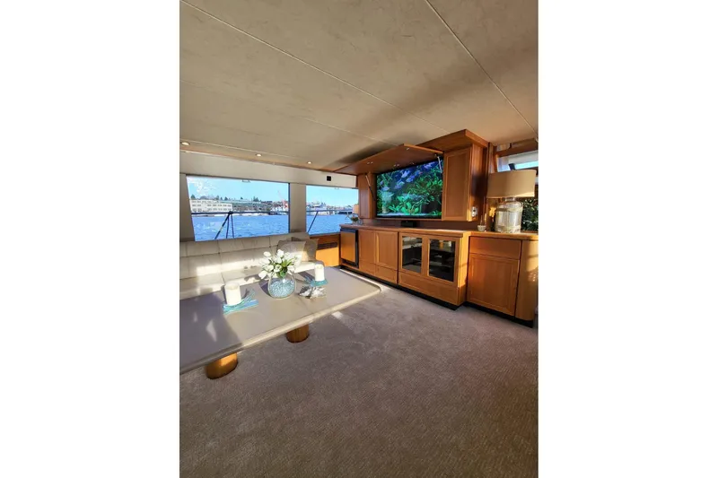 Slide: The Image of Luxurious interior of 1999 Pacific Mariner 65 Motoryacht with elegant furnishings and scenic views. - 29