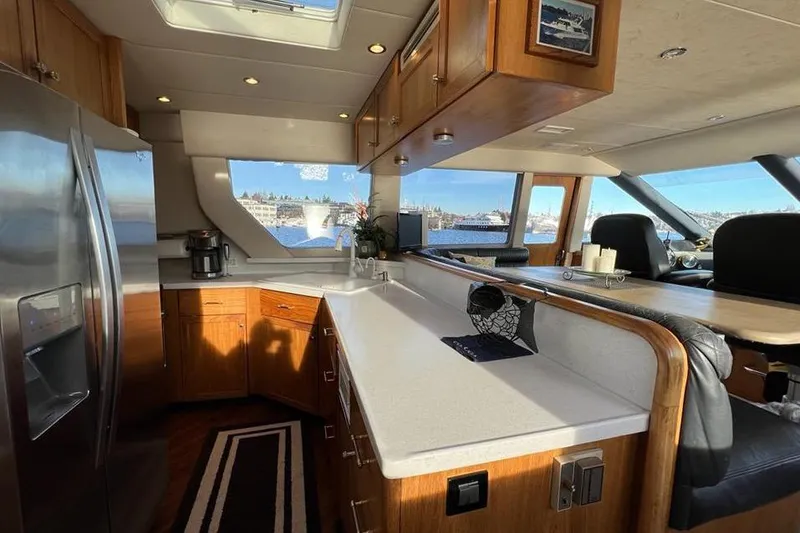 Slide: The Image of Luxurious kitchen interior of 1999 Pacific Mariner 65 Motoryacht with modern amenities. - 36