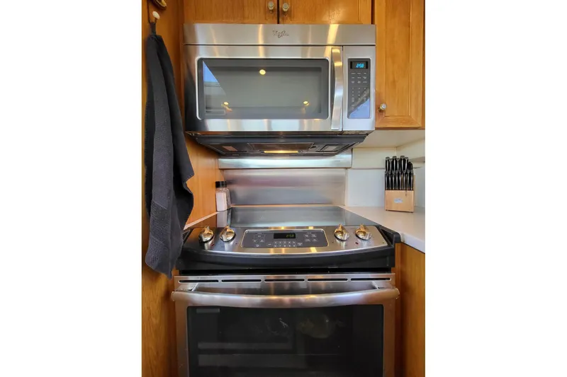 Slide: The Image of Modern kitchen in 1999 Pacific Mariner 65 Motoryacht with stainless steel appliances. - 37