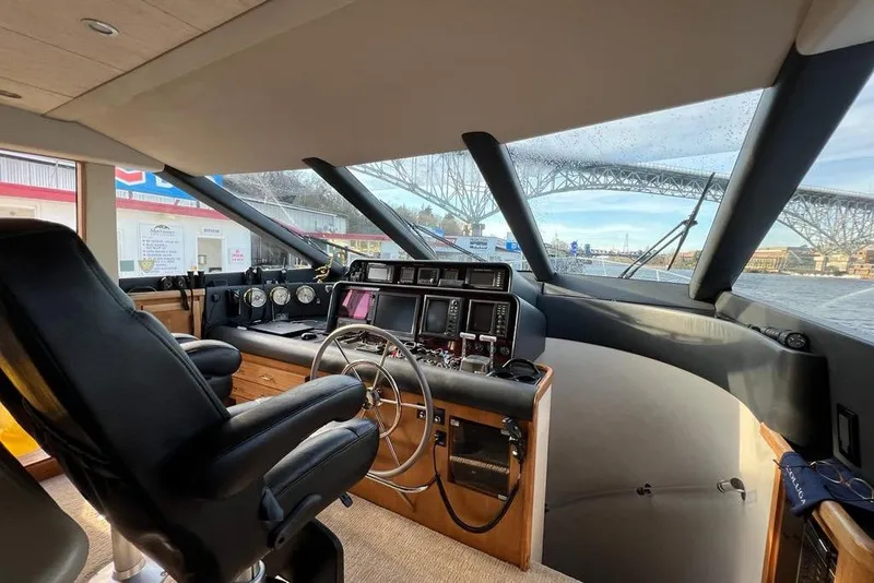 Slide: The Image of Interior helm of 1999 Pacific Mariner 65 Motoryacht with navigation controls and panoramic view. - 43