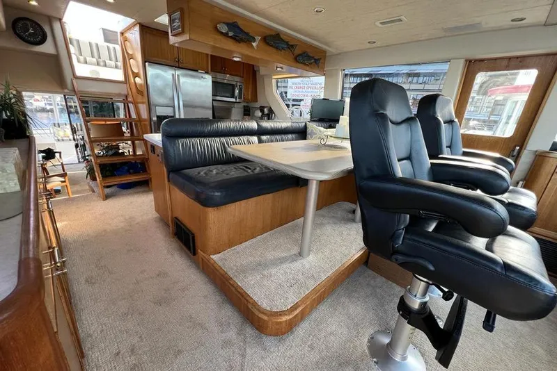 Slide: The Image of Luxurious interior of 1999 Pacific Mariner 65 Motoryacht with leather seating and modern amenities. - 45