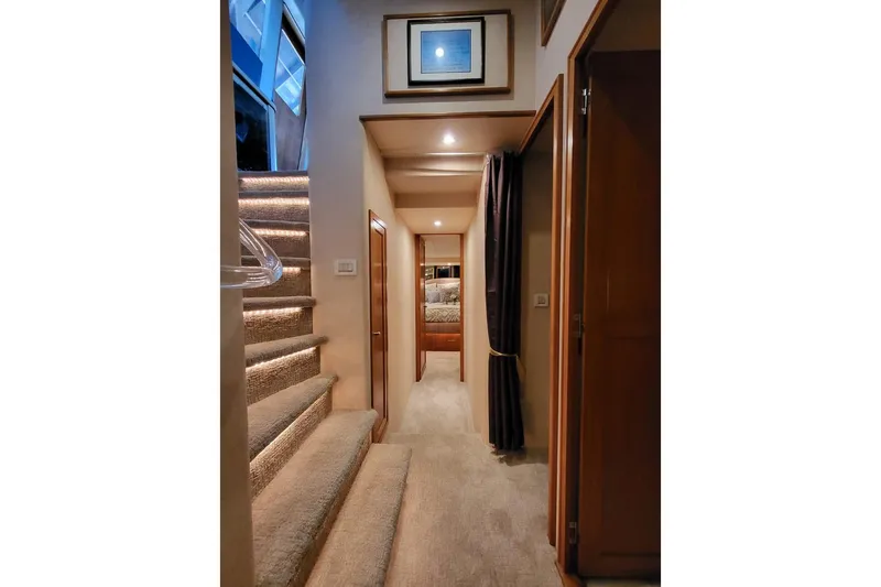Slide: The Image of Interior of 1999 Pacific Mariner 65 Motoryacht with carpeted stairs and cozy hallway. - 48