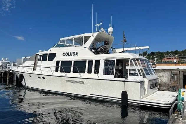 Slide: The Image of 1999 Pacific Mariner 65 Motoryacht docked at marina under clear blue sky. - 5