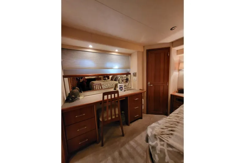 Slide: The Image of Interior of 1999 Pacific Mariner 65 Motoryacht with wooden desk and chair. - 52