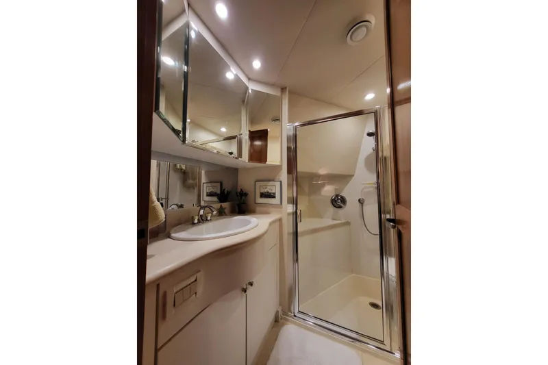 Slide: The Image of Luxurious bathroom in 1999 Pacific Mariner 65 Motoryacht with shower and vanity. - 61