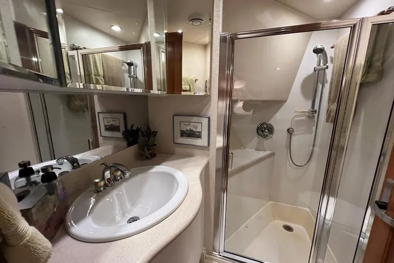 Slide: The Image of Luxurious bathroom in 1999 Pacific Mariner 65 Motoryacht with shower and sink. - 62