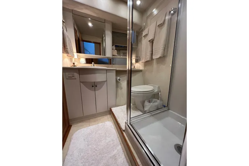 Slide: The Image of Bathroom interior of 1999 Pacific Mariner 65 Motoryacht with shower and vanity. - 67
