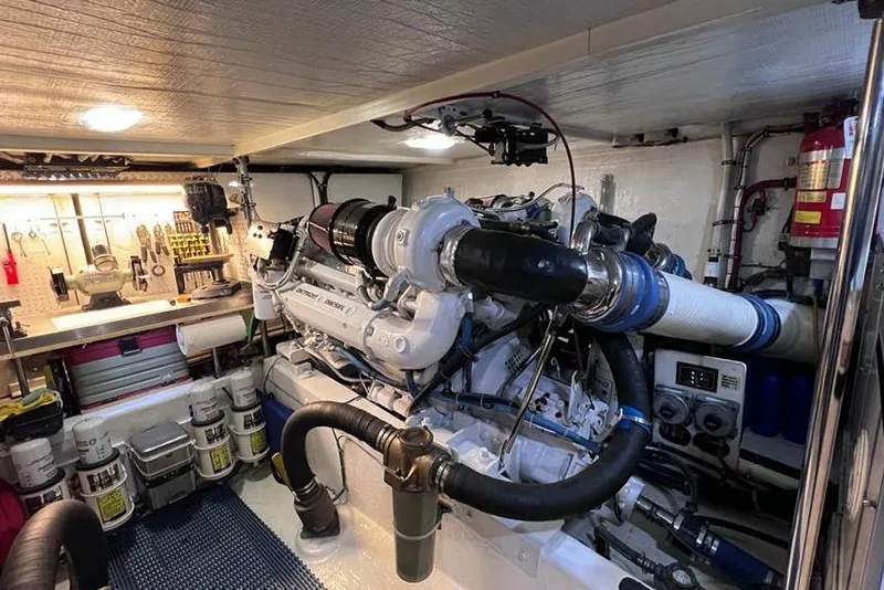 Slide: The Image of Engine room of a 1999 Pacific Mariner 65 Motoryacht, featuring a well-organized workspace. - 72