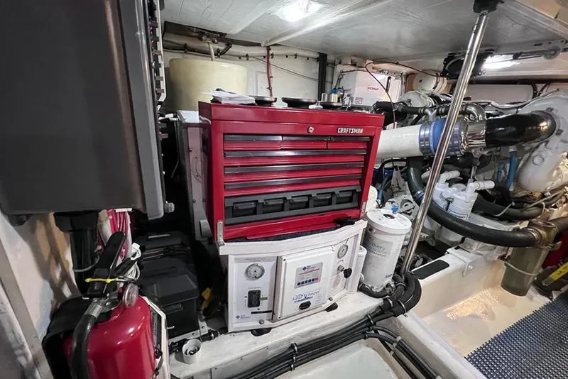 Slide: The Image of Engine room of 1999 Pacific Mariner 65 Motoryacht with red Craftsman tool chest. - 74