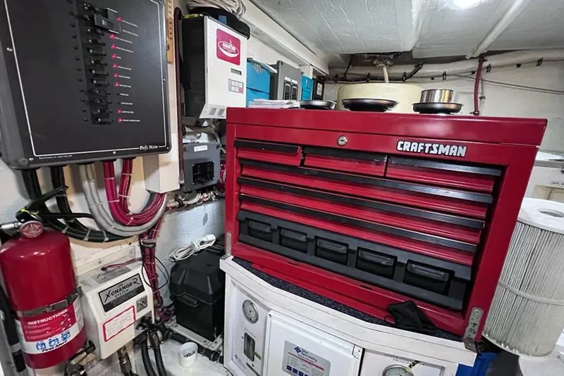 Slide: The Image of Engine room of 1999 Pacific Mariner 65 Motoryacht with red Craftsman tool chest. - 76