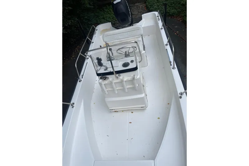 Slide: The Image of 2008 Boston Whaler 170 Montauk boat interior with console and seating. - 5